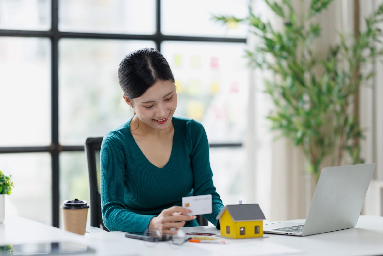 Woman reviewing financial information on a laptop